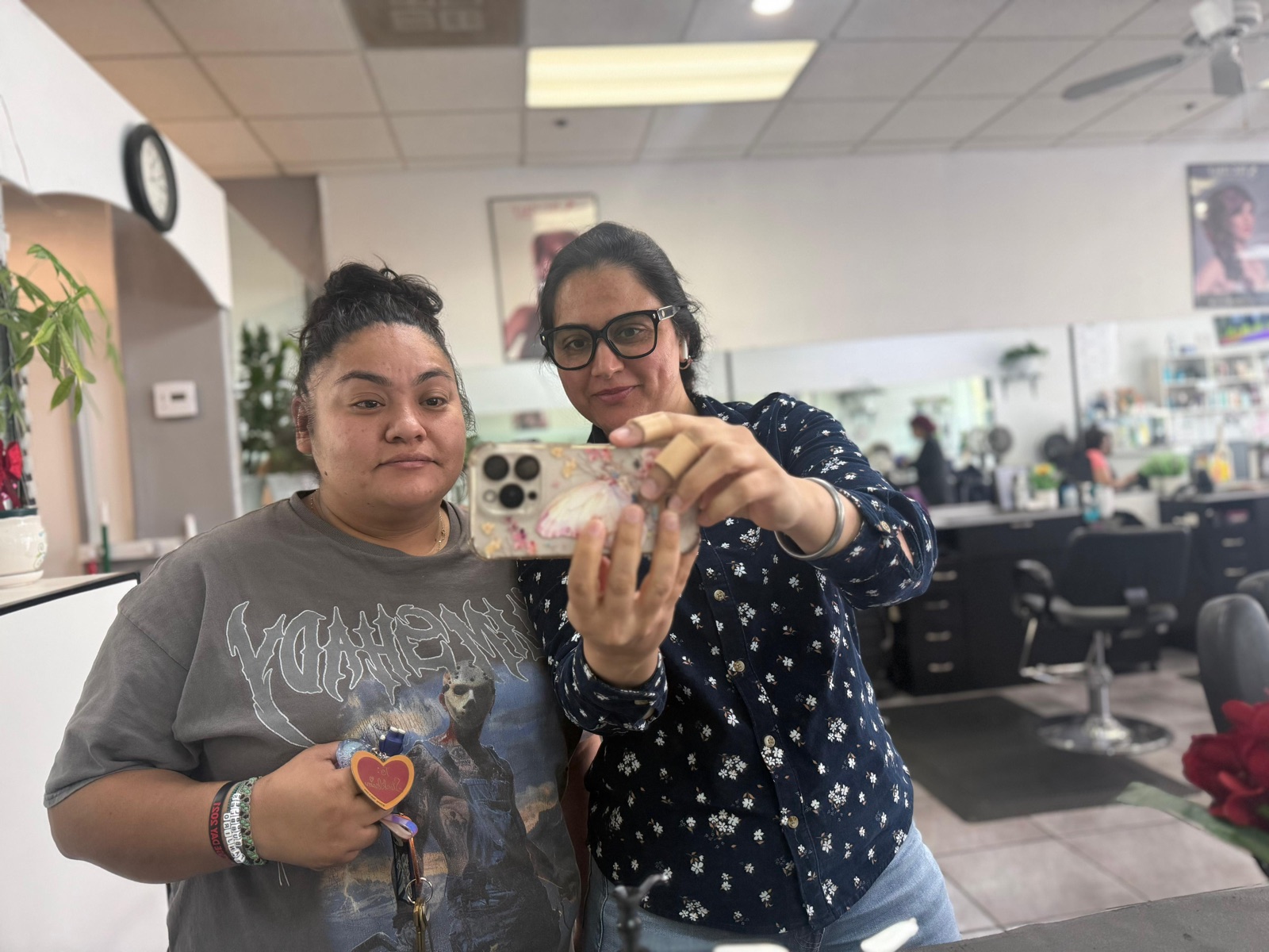 Hardeep with a client inside the EZ iBrows salon space.